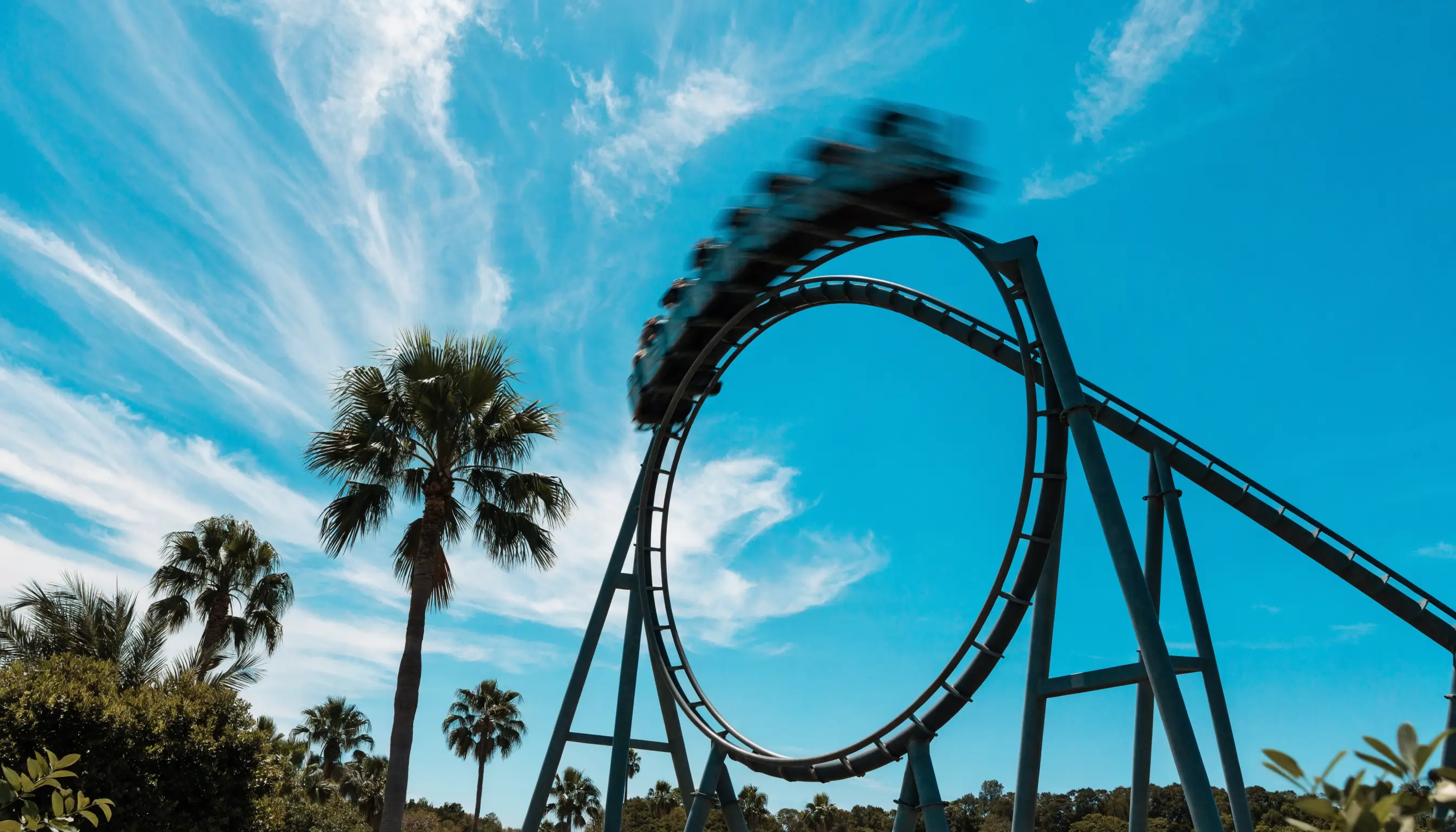 Roller coaster against a bright sky